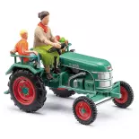 Kramer KL 11 tractor met boer en kind