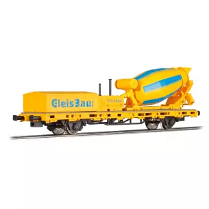 Low-loader with concrete mixer and blue inscription "GleisBau" in yellow delivery
