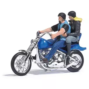Couple riding on a Custom Motorcycle