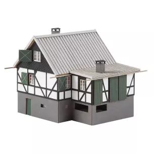 Forest refuge in white and grey wall with green shutter