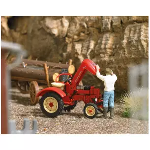 Porsche tractor with raised engine hood and mechanic