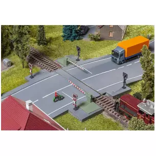 Barrières de passage à niveau avec pièce d'entraînement