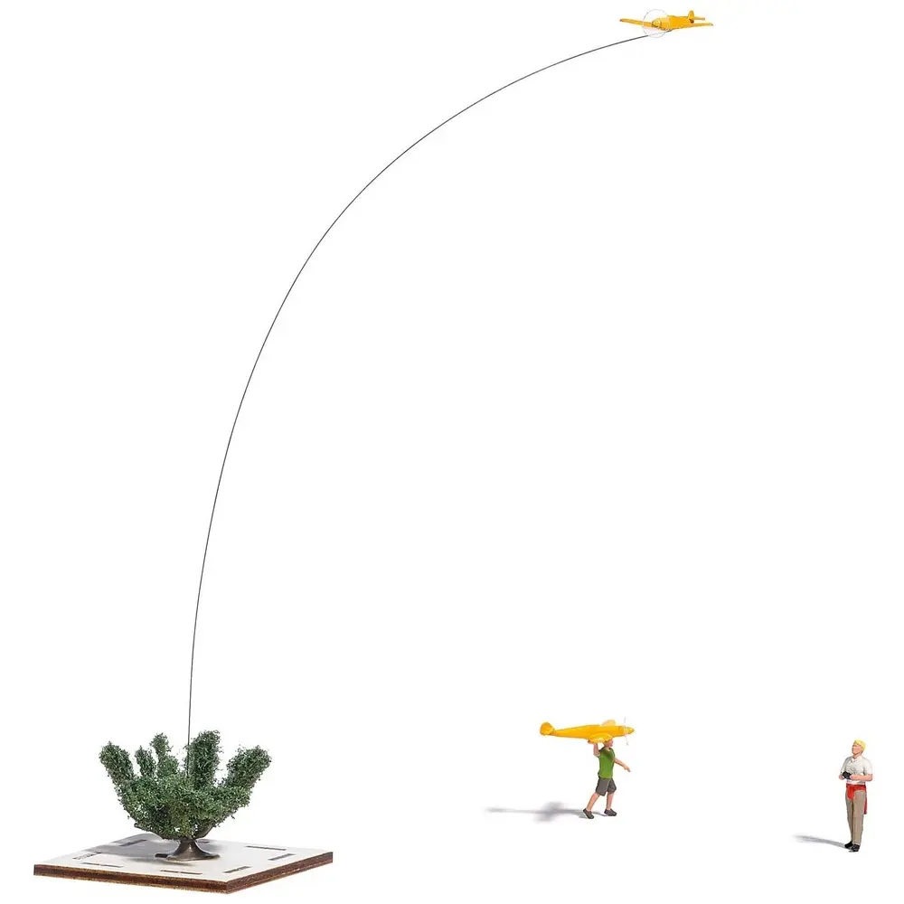 Un père et son fils pilotant un avion radiocommandé - BUSCH 5487 - HO 1/87