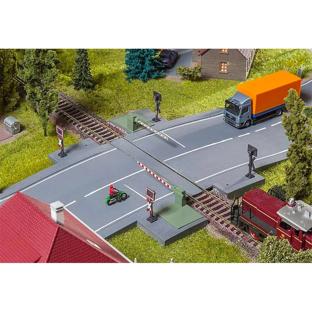 Barrières de passage à niveau avec pièce d'entraînement