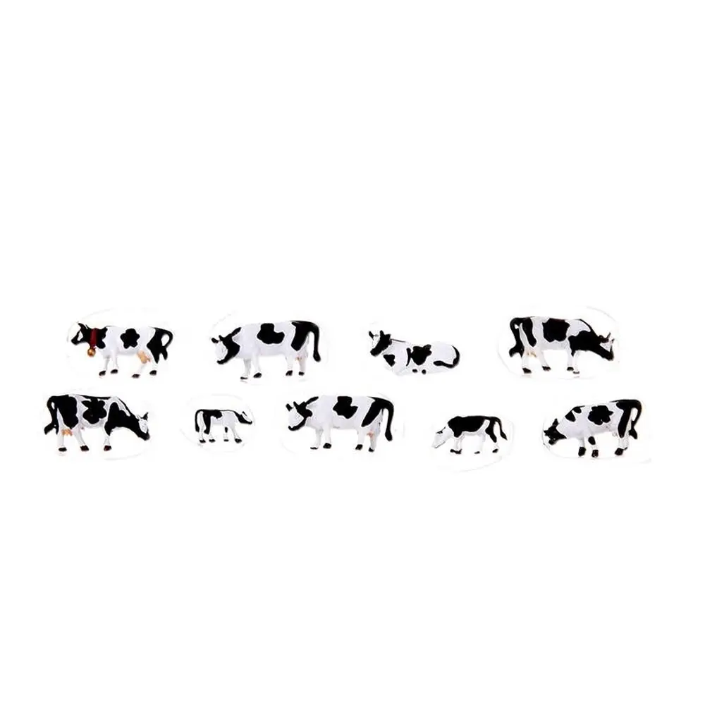 9 vaches noires et blanches
