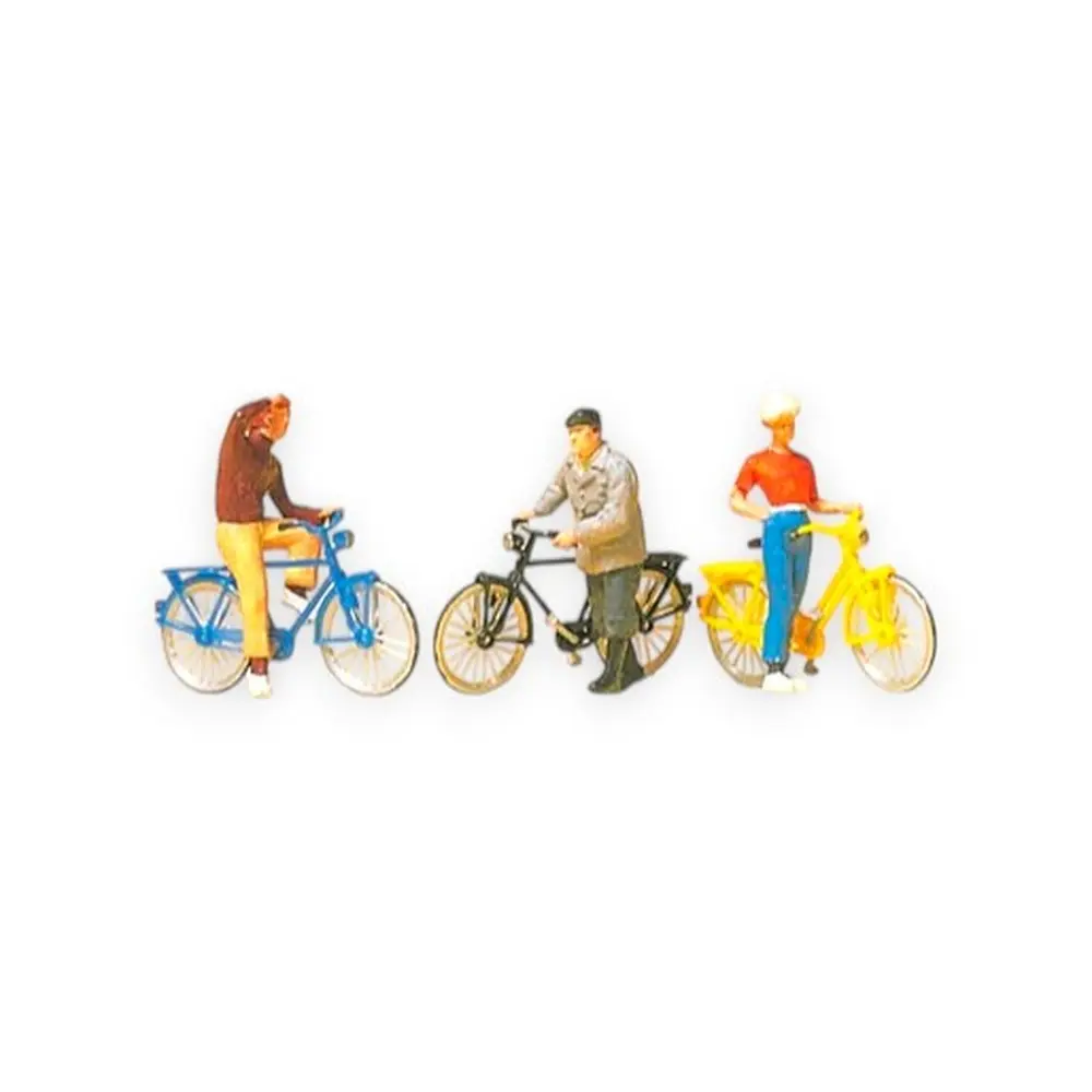 Cyclistes attendant au croisement de chemins de fer